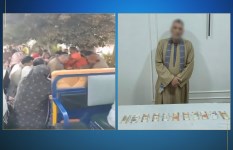 المتورط بتوزيع مبالغ مالية على المواطنين أمام اللجان